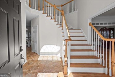 Welcome home to this timeless brick traditional nestled at the on Brookstone Golf and Country Club in Georgia - for sale on GolfHomes.com, golf home, golf lot