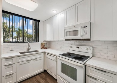 Beautiful and completely remodeled corner unit townhouse with on Fountains Golf and Country Club in Florida - for sale on GolfHomes.com, golf home, golf lot