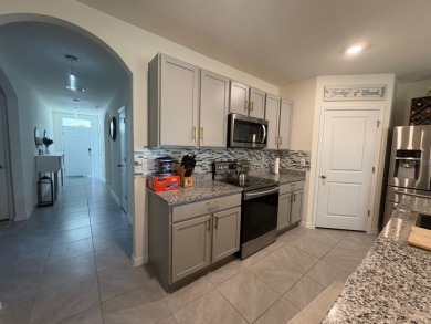 Enjoy peaceful golf course views in this like-new 4-bedroom on Lake Diamond Golf and Country Club in Florida - for sale on GolfHomes.com, golf home, golf lot