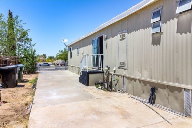 This 3-bedroom, 2-bath home offers 1,380 sq ft on a 6,811 sq ft on Green Tree Golf Course in California - for sale on GolfHomes.com, golf home, golf lot