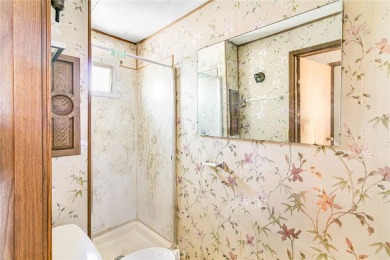 This 3-bedroom, 2-bath home offers 1,380 sq ft on a 6,811 sq ft on Green Tree Golf Course in California - for sale on GolfHomes.com, golf home, golf lot