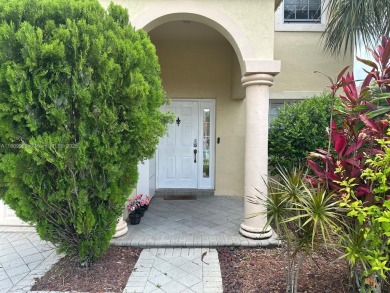 Beautiful lakefront single-family home in the sought-after Grand on Palm Beach Polo and Country Club in Florida - for sale on GolfHomes.com, golf home, golf lot