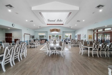 Beautiful lakefront single-family home in the sought-after Grand on Palm Beach Polo and Country Club in Florida - for sale on GolfHomes.com, golf home, golf lot