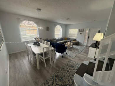 Beautiful lakefront single-family home in the sought-after Grand on Palm Beach Polo and Country Club in Florida - for sale on GolfHomes.com, golf home, golf lot