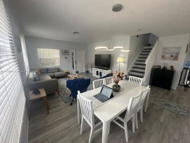 Beautiful lakefront single-family home in the sought-after Grand on Palm Beach Polo and Country Club in Florida - for sale on GolfHomes.com, golf home, golf lot