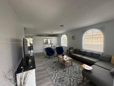 Beautiful lakefront single-family home in the sought-after Grand on Palm Beach Polo and Country Club in Florida - for sale on GolfHomes.com, golf home, golf lot