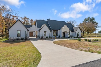 Stunning 2023 custom one-story home on a beautifully treed on Cedar Creek Country Club in Texas - for sale on GolfHomes.com, golf home, golf lot