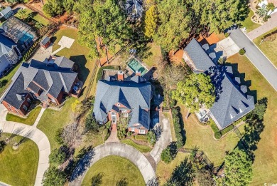 Surrounded by lush greenery and the quiet peacefulness that is on Myrtlewood Golf Course and Club  in South Carolina - for sale on GolfHomes.com, golf home, golf lot