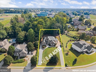 Welcome home to this stunning 5-bedroom, 3.5-bathroom gem on Traditions of Braselton Golf Club in Georgia - for sale on GolfHomes.com, golf home, golf lot