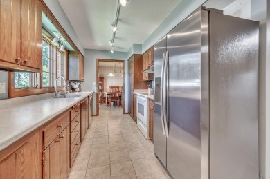 Welcome to 1305 18th Ave W--a beautifully maintained brick ranch on Spencer Golf and Country Club in Iowa - for sale on GolfHomes.com, golf home, golf lot