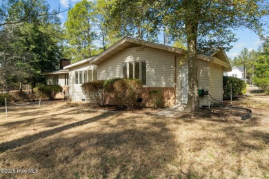 Charming home with great Golf Course views. This custom home was on Foxfire Golf and Country Club in North Carolina - for sale on GolfHomes.com, golf home, golf lot