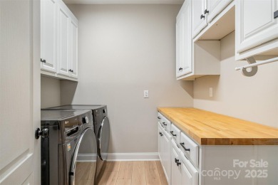 This fully renovated brick ranch with a basement offers luxury on Verdict Ridge Golf and Country Club in North Carolina - for sale on GolfHomes.com, golf home, golf lot