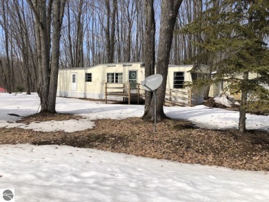 1971 two bedroom mobile home with conventionally built addition on Lakes of the North Deer Run Golf Course in Michigan - for sale on GolfHomes.com, golf home, golf lot
