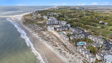 Experience coastal living at its finest in this beautifully on Wild Dunes Harbor Golf Resort in South Carolina - for sale on GolfHomes.com, golf home, golf lot