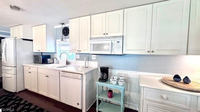 WATERFRONT HOME WITH BOAT DOCK/LIFT. Welcome to your dream home on Riverbend Golf and Country Club in Florida - for sale on GolfHomes.com, golf home, golf lot