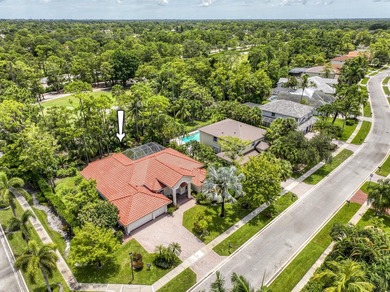 This updated home with NEW ROOF offers an open split floor plan on Binks Forest Golf Club in Florida - for sale on GolfHomes.com, golf home, golf lot