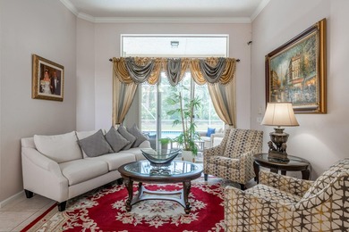 This updated home with NEW ROOF offers an open split floor plan on Binks Forest Golf Club in Florida - for sale on GolfHomes.com, golf home, golf lot