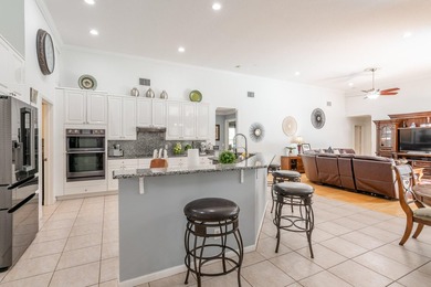 This updated home with NEW ROOF offers an open split floor plan on Binks Forest Golf Club in Florida - for sale on GolfHomes.com, golf home, golf lot