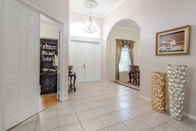 This updated home with NEW ROOF offers an open split floor plan on Binks Forest Golf Club in Florida - for sale on GolfHomes.com, golf home, golf lot