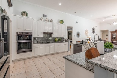 This updated home with NEW ROOF offers an open split floor plan on Binks Forest Golf Club in Florida - for sale on GolfHomes.com, golf home, golf lot