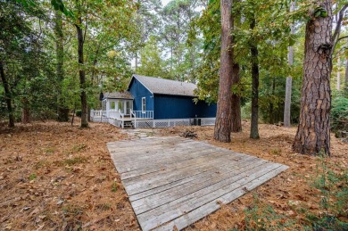 Nestled in a serene, wooded interior lot, this beautifully on Holly Lake Ranch Golf Club in Texas - for sale on GolfHomes.com, golf home, golf lot