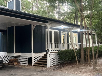 Nestled in a serene, wooded interior lot, this beautifully on Holly Lake Ranch Golf Club in Texas - for sale on GolfHomes.com, golf home, golf lot
