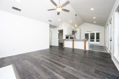 Nestled in a serene, wooded interior lot, this beautifully on Holly Lake Ranch Golf Club in Texas - for sale on GolfHomes.com, golf home, golf lot