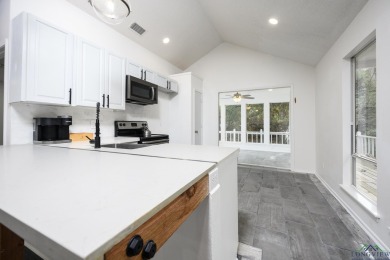 Nestled in a serene, wooded interior lot, this beautifully on Holly Lake Ranch Golf Club in Texas - for sale on GolfHomes.com, golf home, golf lot
