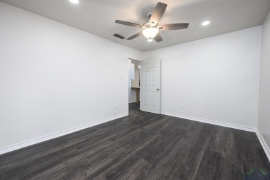Nestled in a serene, wooded interior lot, this beautifully on Holly Lake Ranch Golf Club in Texas - for sale on GolfHomes.com, golf home, golf lot