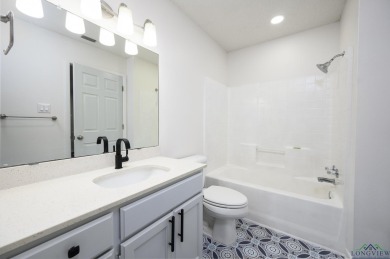 Nestled in a serene, wooded interior lot, this beautifully on Holly Lake Ranch Golf Club in Texas - for sale on GolfHomes.com, golf home, golf lot