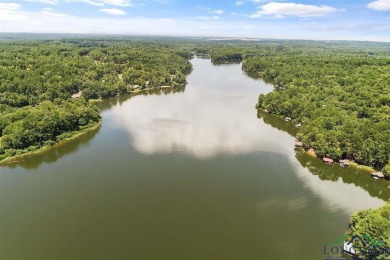 Nestled in a serene, wooded interior lot, this beautifully on Holly Lake Ranch Golf Club in Texas - for sale on GolfHomes.com, golf home, golf lot