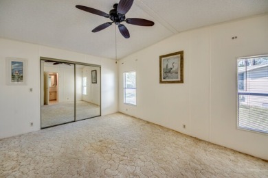 Great 2/2 split floor plan home located on a corner lot in Pine on Pine Lakes Country Club in Florida - for sale on GolfHomes.com, golf home, golf lot
