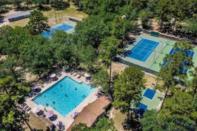 Nestled in a serene, wooded interior lot, this beautifully on Holly Lake Ranch Golf Club in Texas - for sale on GolfHomes.com, golf home, golf lot