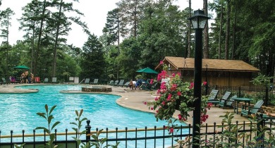 Nestled in a serene, wooded interior lot, this beautifully on Holly Lake Ranch Golf Club in Texas - for sale on GolfHomes.com, golf home, golf lot