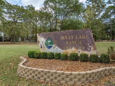 Nestled in a serene, wooded interior lot, this beautifully on Holly Lake Ranch Golf Club in Texas - for sale on GolfHomes.com, golf home, golf lot