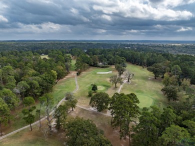 Nestled in a serene, wooded interior lot, this beautifully on Holly Lake Ranch Golf Club in Texas - for sale on GolfHomes.com, golf home, golf lot