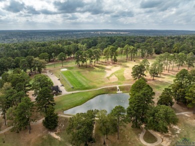 Nestled in a serene, wooded interior lot, this beautifully on Holly Lake Ranch Golf Club in Texas - for sale on GolfHomes.com, golf home, golf lot