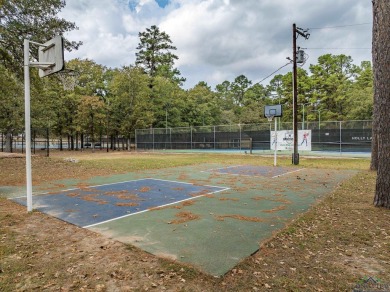 Nestled in a serene, wooded interior lot, this beautifully on Holly Lake Ranch Golf Club in Texas - for sale on GolfHomes.com, golf home, golf lot