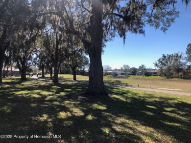 A brand new roof will top this beautiful home before closing! on Hernando Oaks Golf and Country Club in Florida - for sale on GolfHomes.com, golf home, golf lot