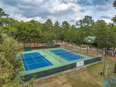 Nestled in a serene, wooded interior lot, this beautifully on Holly Lake Ranch Golf Club in Texas - for sale on GolfHomes.com, golf home, golf lot