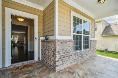 Welcome to this meticulously maintained northeast-facing home in on Sugar Hill Golf Club in Georgia - for sale on GolfHomes.com, golf home, golf lot