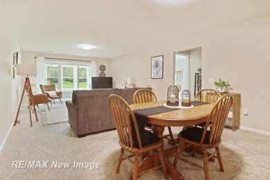 Completely Redone in 2023! This stunning first-floor, end unit on Swan Valley Golf Club in Michigan - for sale on GolfHomes.com, golf home, golf lot