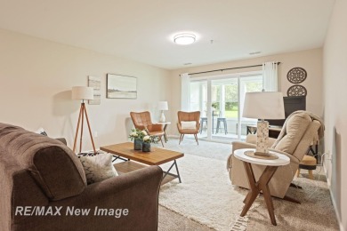 Completely Redone in 2023! This stunning first-floor, end unit on Swan Valley Golf Club in Michigan - for sale on GolfHomes.com, golf home, golf lot