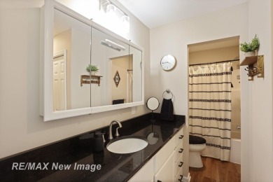 Completely Redone in 2023! This stunning first-floor, end unit on Swan Valley Golf Club in Michigan - for sale on GolfHomes.com, golf home, golf lot