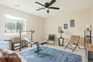 Completely Redone in 2023! This stunning first-floor, end unit on Swan Valley Golf Club in Michigan - for sale on GolfHomes.com, golf home, golf lot