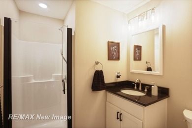 Completely Redone in 2023! This stunning first-floor, end unit on Swan Valley Golf Club in Michigan - for sale on GolfHomes.com, golf home, golf lot