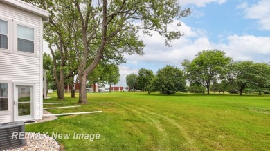 Completely Redone in 2023! This stunning first-floor, end unit on Swan Valley Golf Club in Michigan - for sale on GolfHomes.com, golf home, golf lot