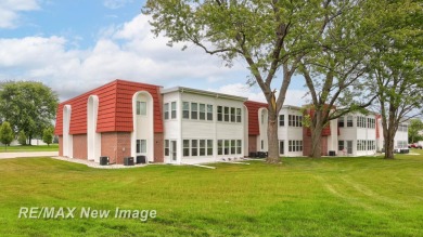Completely Redone in 2023! This stunning first-floor, end unit on Swan Valley Golf Club in Michigan - for sale on GolfHomes.com, golf home, golf lot