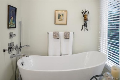 Discover elevated living in this impeccably updated on The Heathers Club in Michigan - for sale on GolfHomes.com, golf home, golf lot