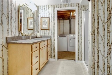Discover elevated living in this impeccably updated on The Heathers Club in Michigan - for sale on GolfHomes.com, golf home, golf lot